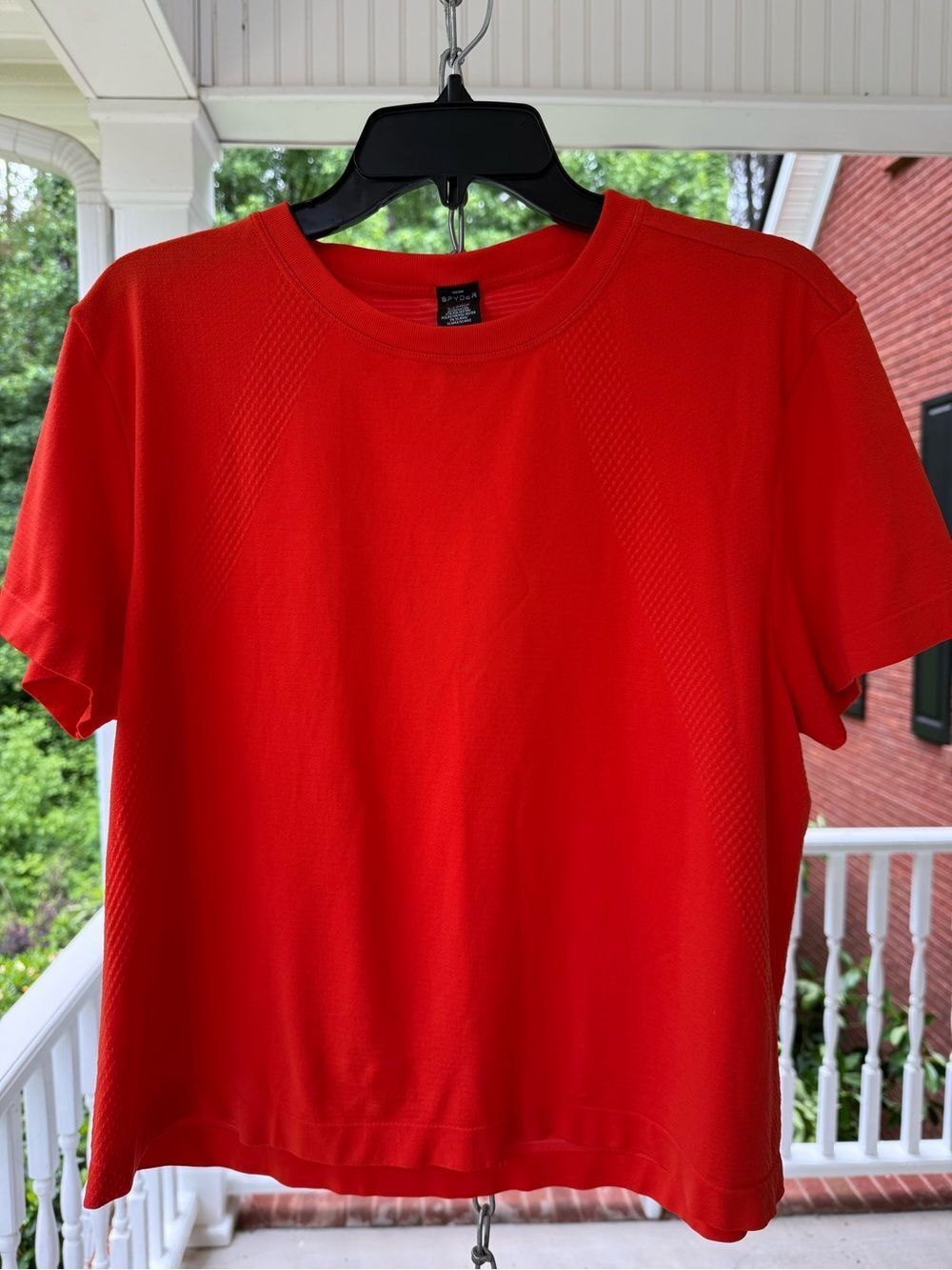 Spyder Women’s Orange Active Tee with White Spider Logo. Size XL